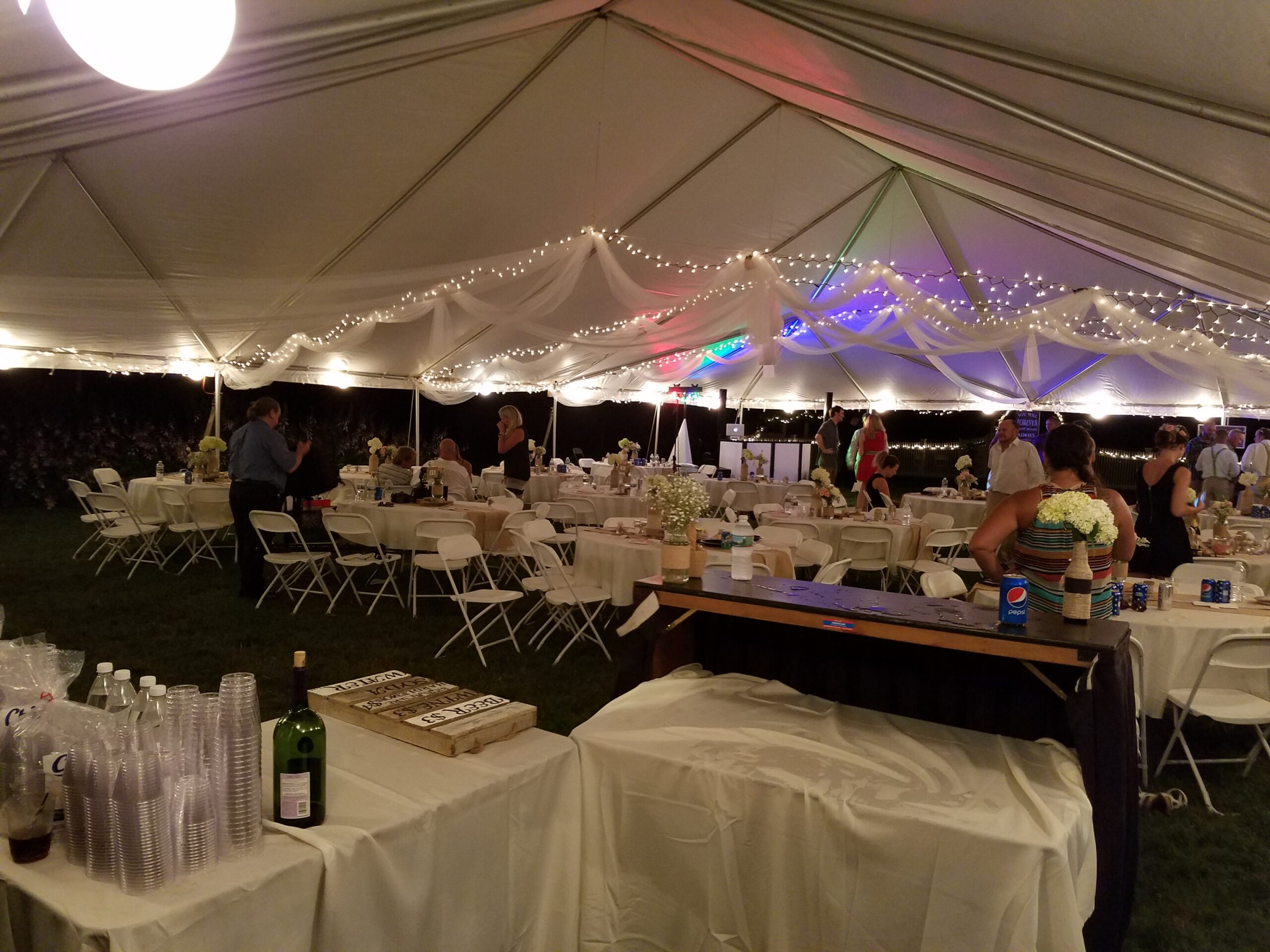 Inside a white tent during a corporate event