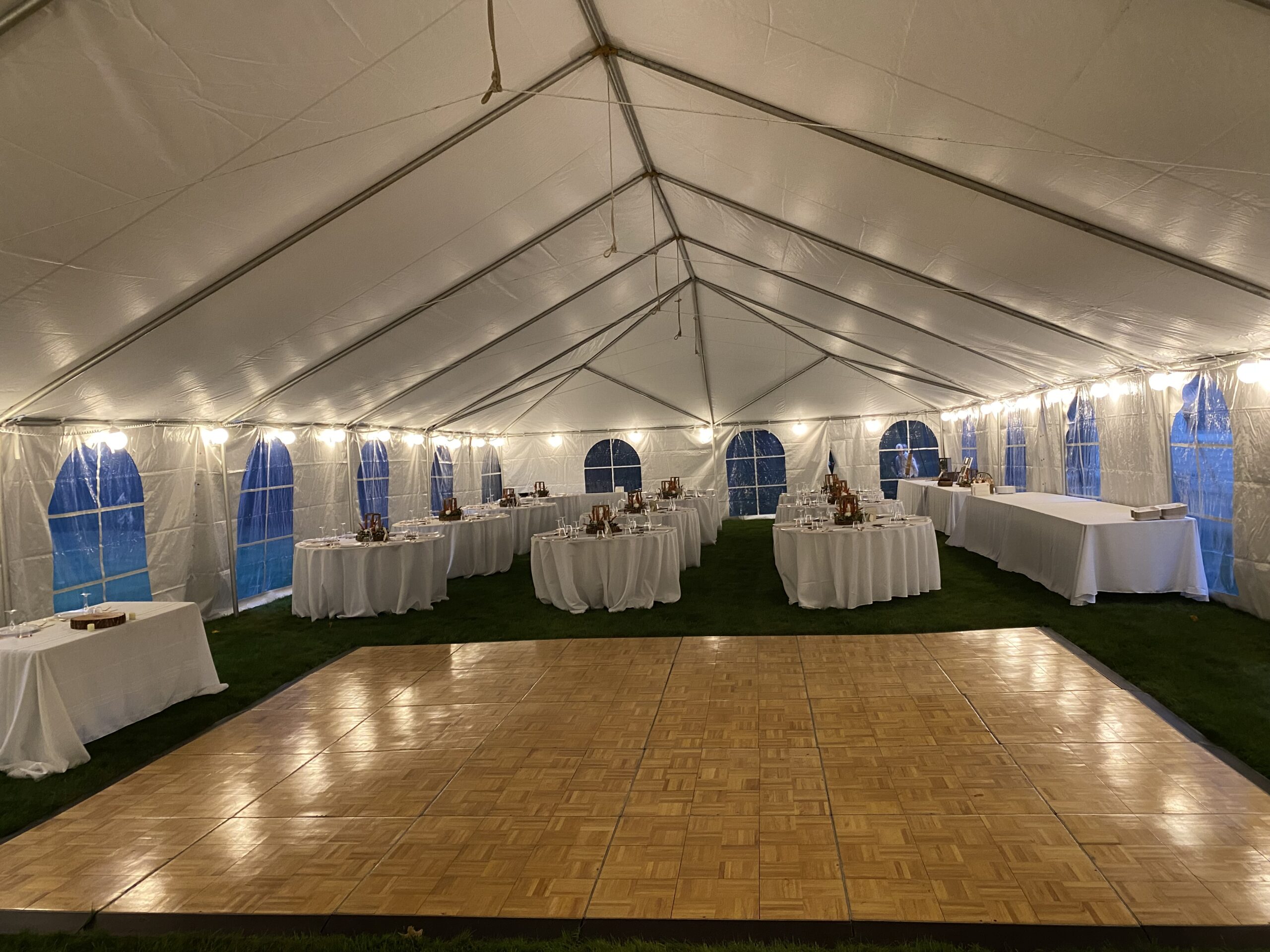 Set-up tent with tables and a dance floor